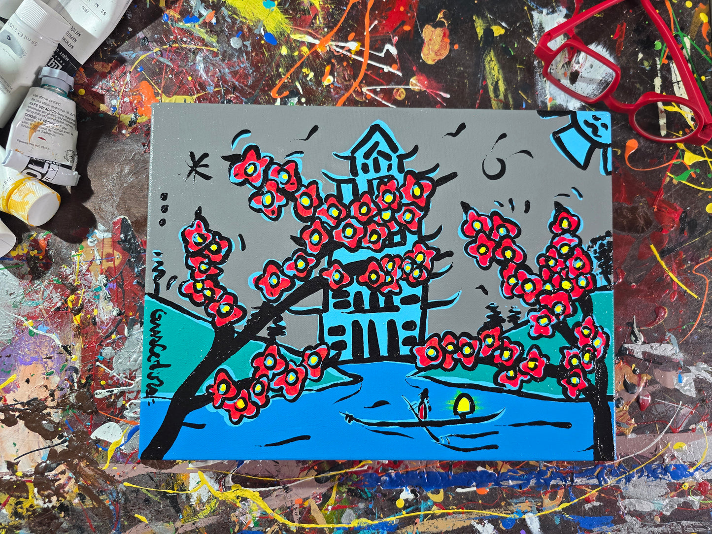 Artistic depiction of a pagoda with cherry blossoms on a colorful background